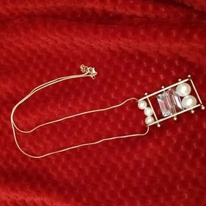 Pearl and Gold necklace with clear piece in the middle